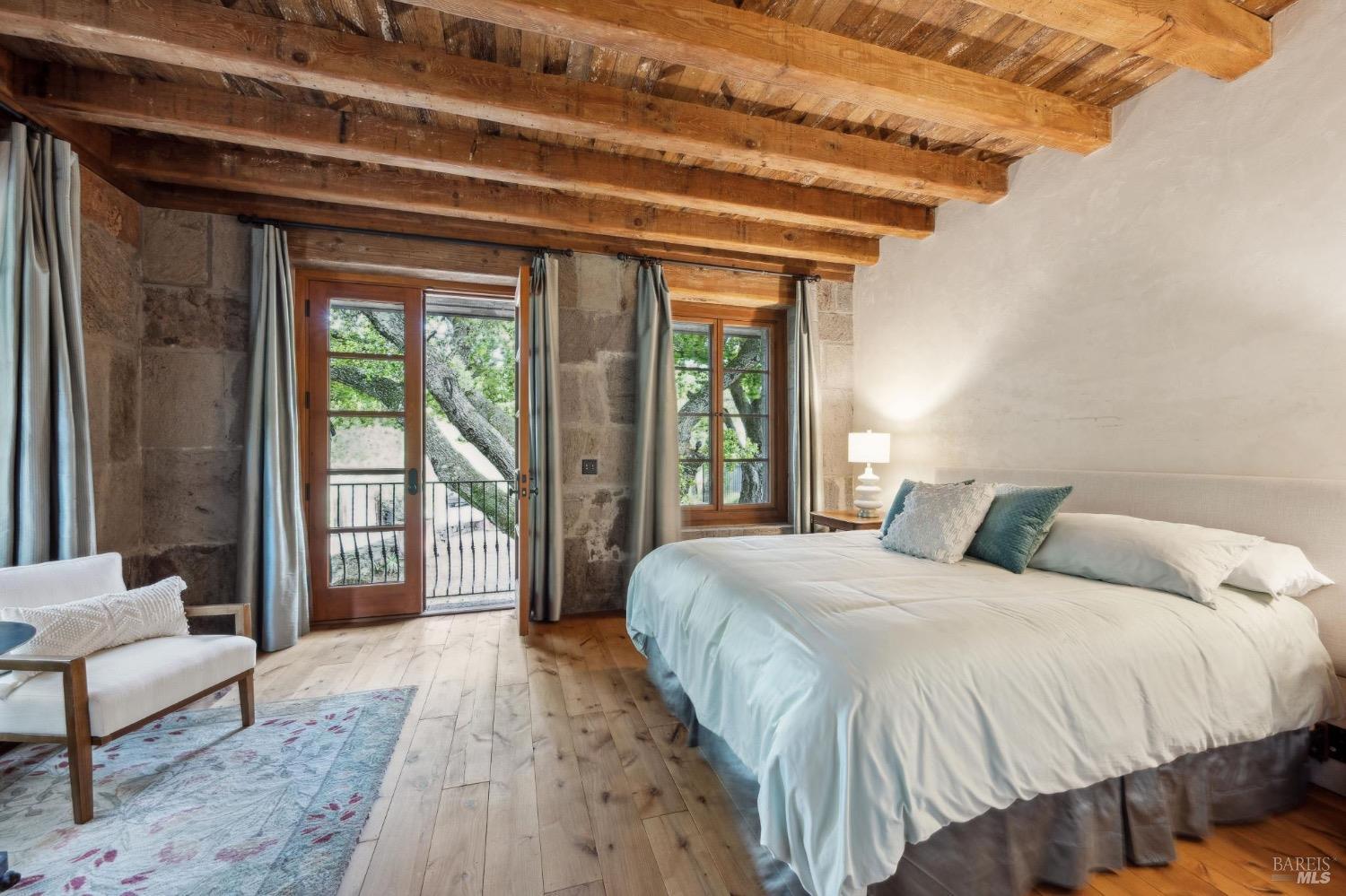 A bedroom in stone and timber